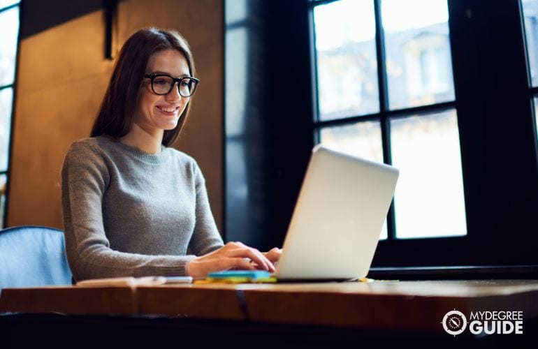 Woman taking Masters in Web Development Online