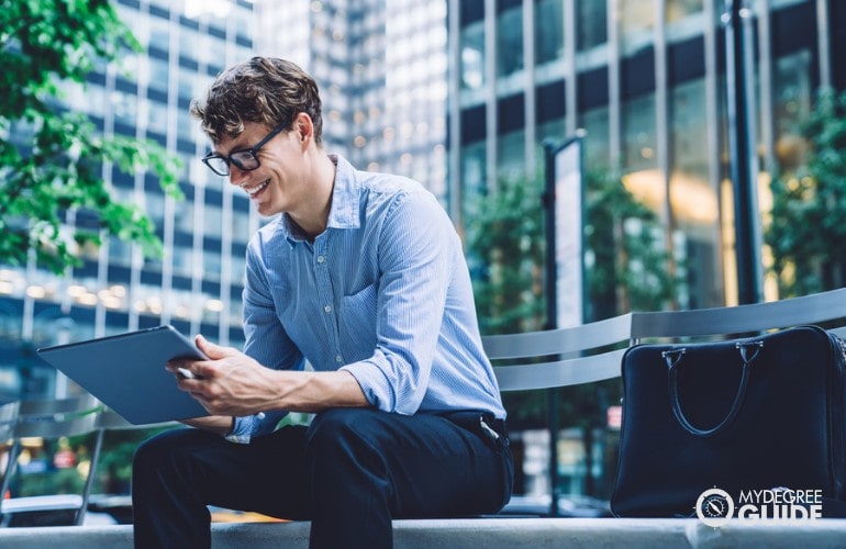 Political Science Major studying on his tablet