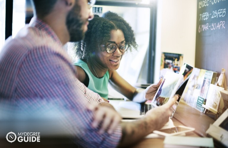 social media marketers discussing in an office