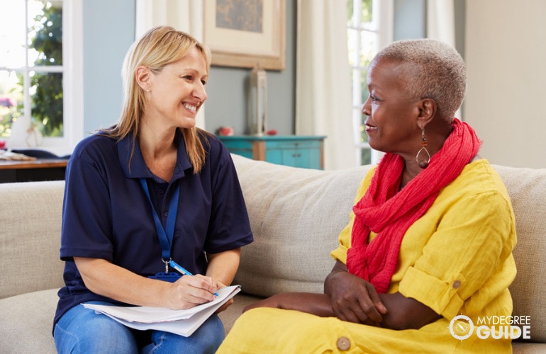 social worker visiting an elderly woman in her home