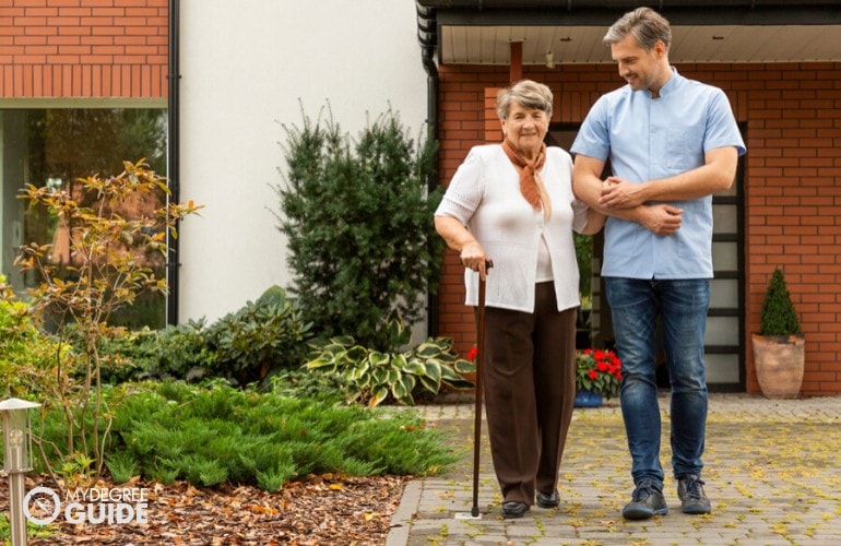 social worker assisting an elderly woman 