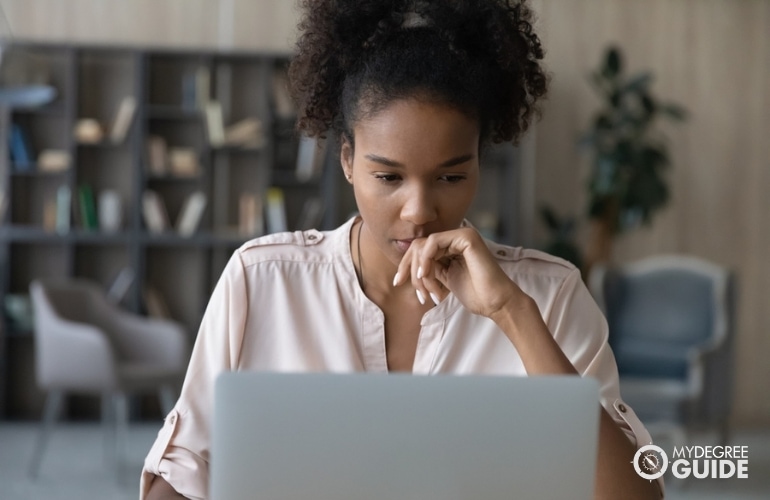 licensed social worker working on her laptop