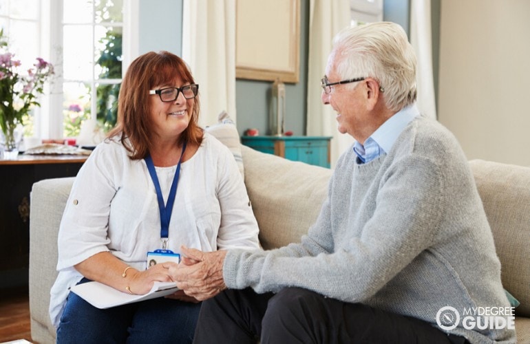 social worker visiting an elderly in his house