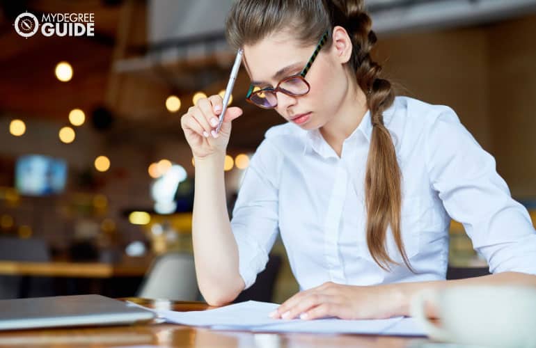 female student looking at a checklist