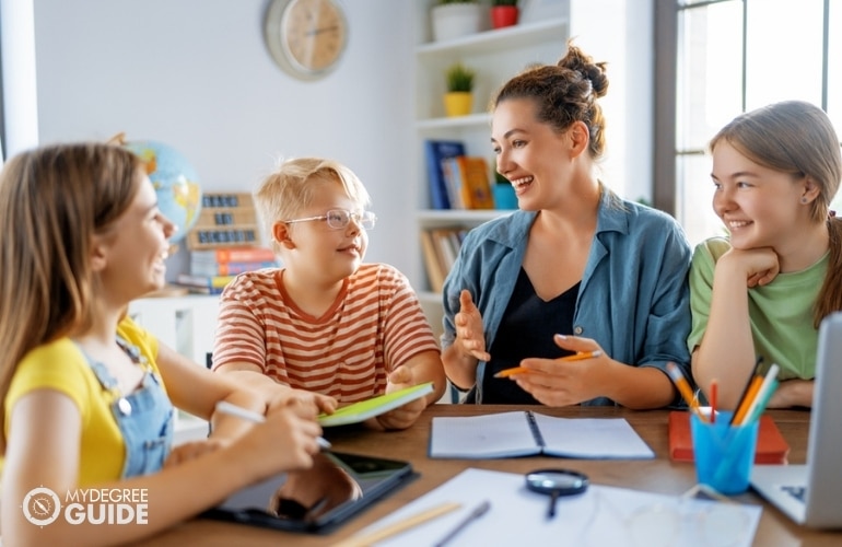 elementary school teacher with her students