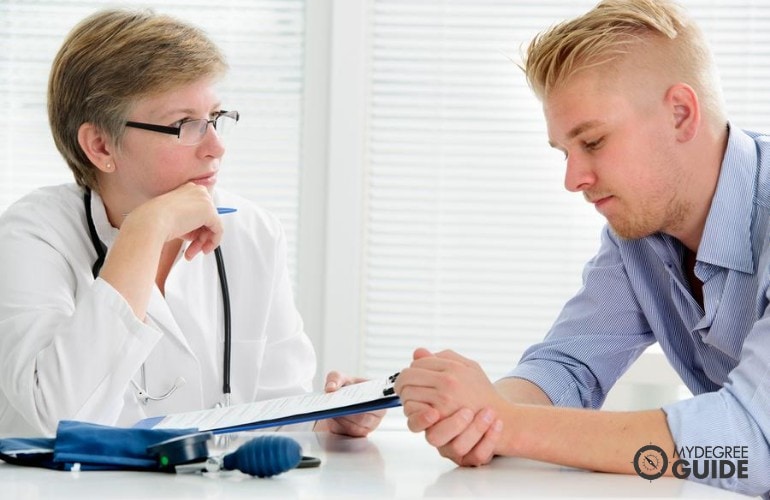 substance abuse counselor listening to her patient