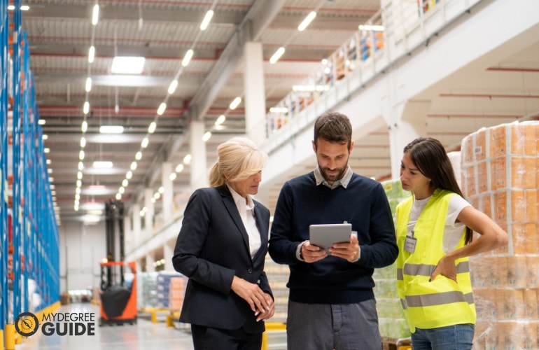 global operations manager checking supplies in a warehouse