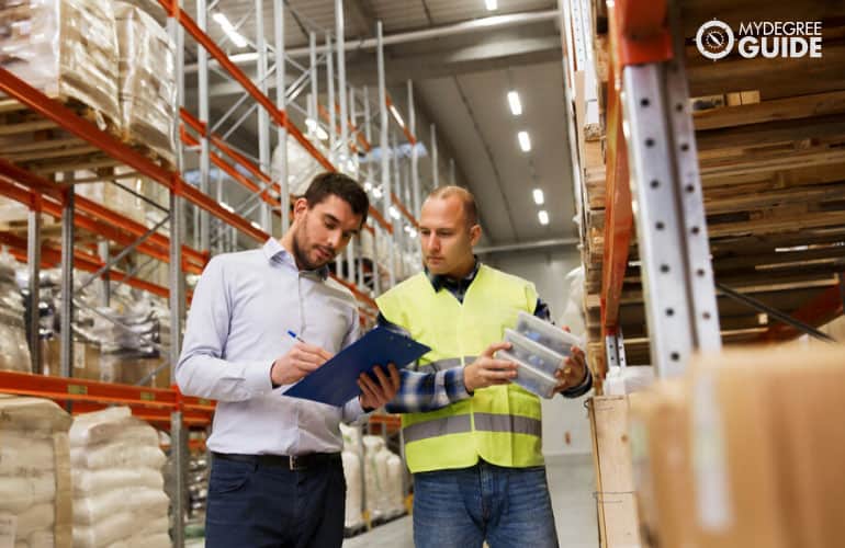 Logistics manager checking inventory in a warehouse