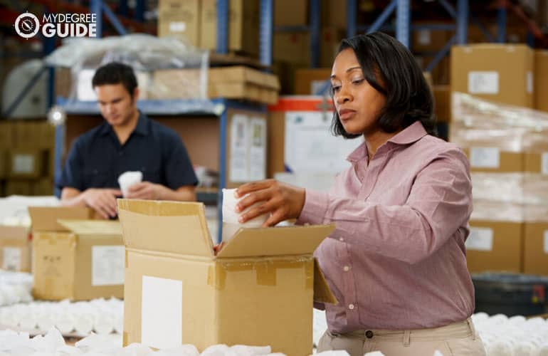 female manager checking the goods in a factory