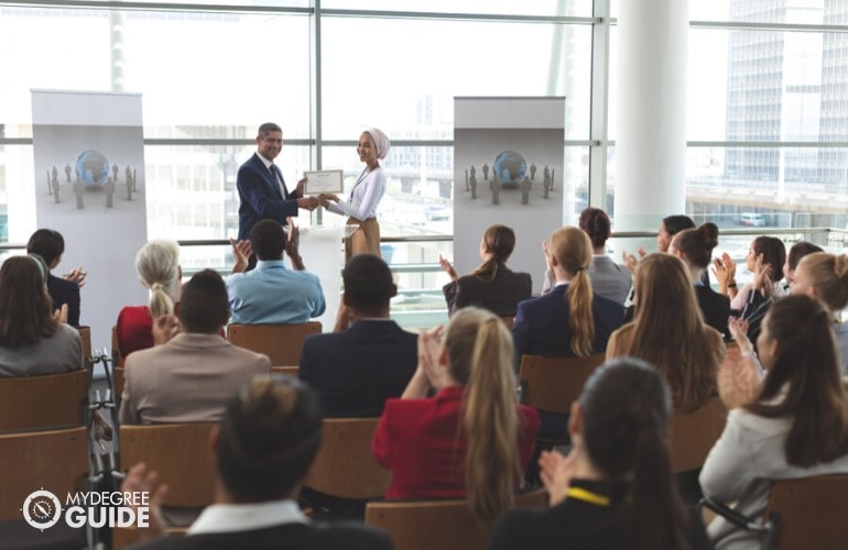 employee receiving a certificate