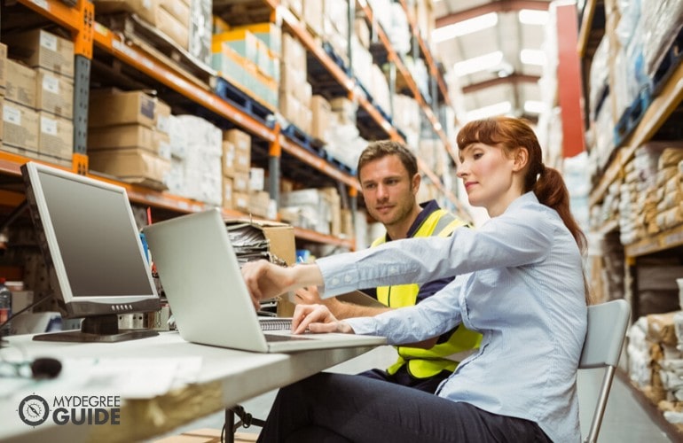 supply chain manager giving instructions to employee