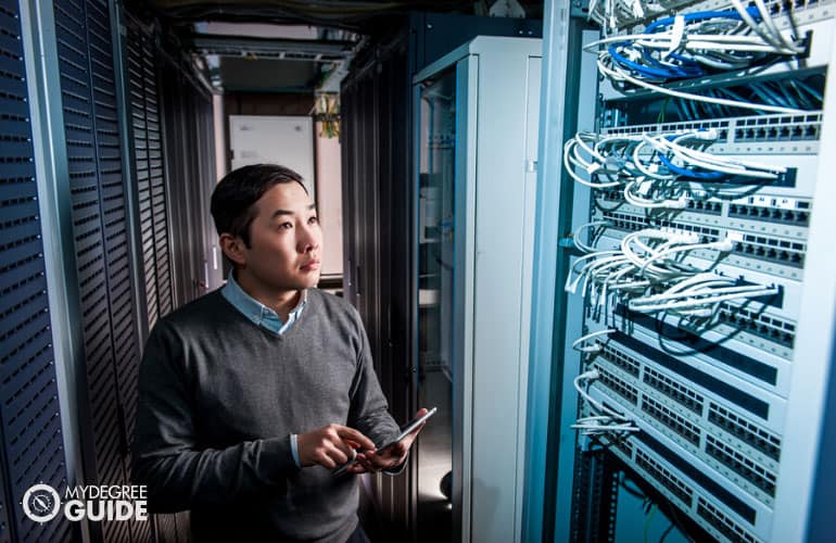 Systems Engineer checking the database room