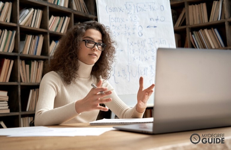 Masters in Teaching degree student studying in library