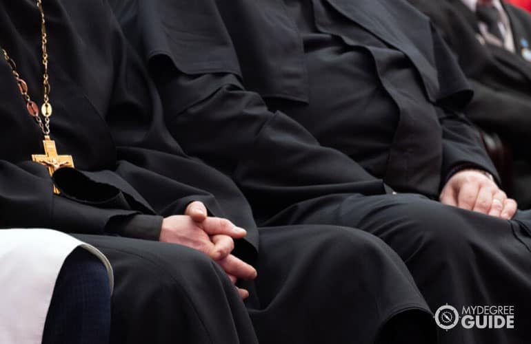 clerics and priests in conference hall