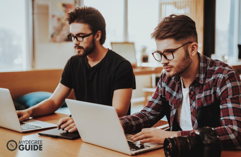 Business College students studying online together