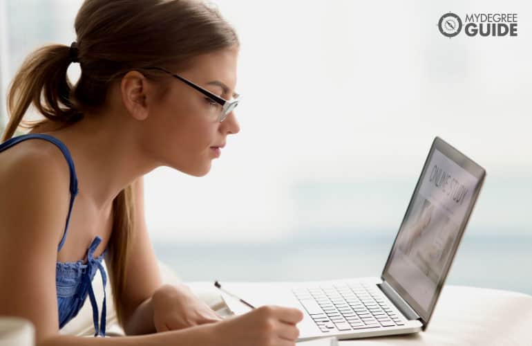 student studying on her computer
