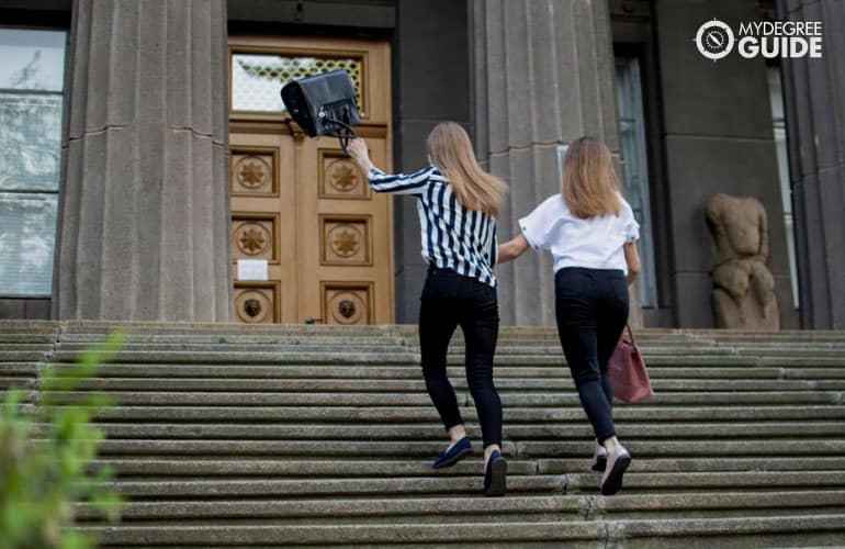 psychology students running in university campus