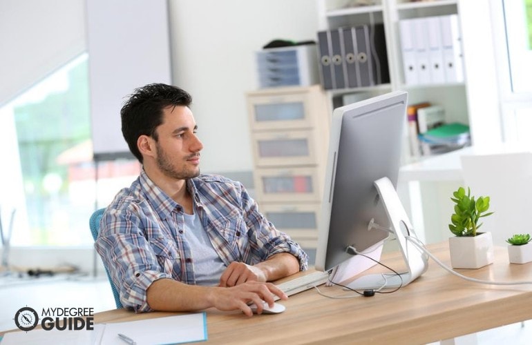 web designer working on his computer in the office