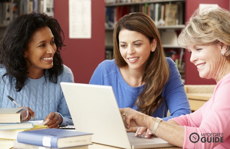 mature college students studying in library