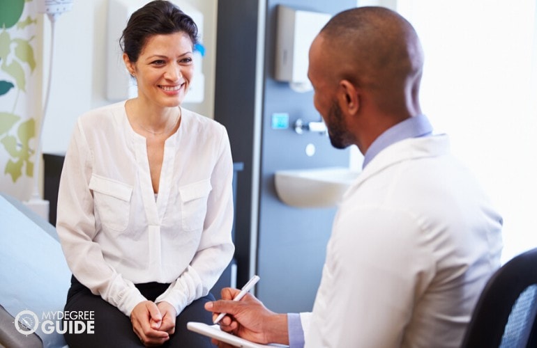 healthcare manager talking to a colleague