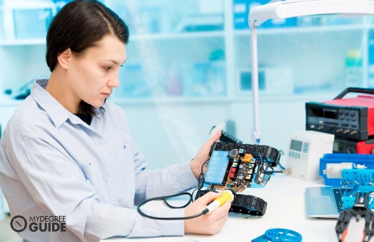 Hardware Engineer testing computer parts in a laboratory