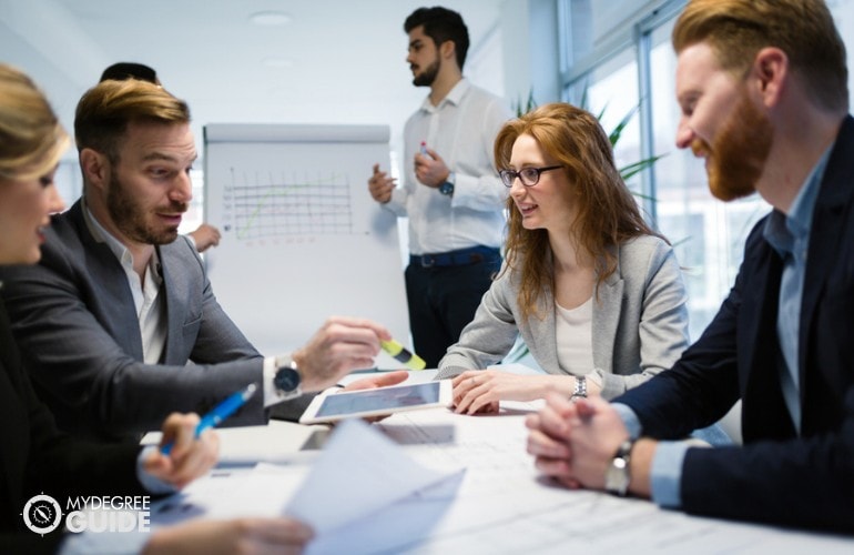 Computer and Information Systems Managers in a meeting