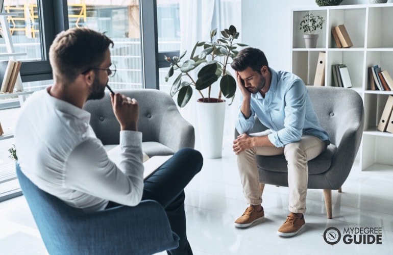 Forensic Psychologist listening to a patient during consultation