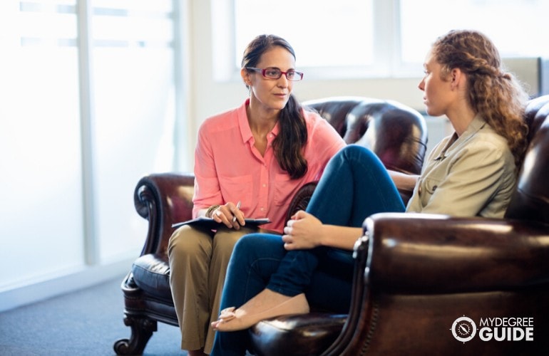 psychologist comforting a client