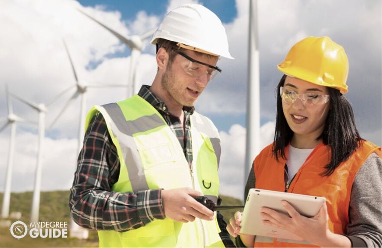 Environmental Engineers discussing while doing field survey