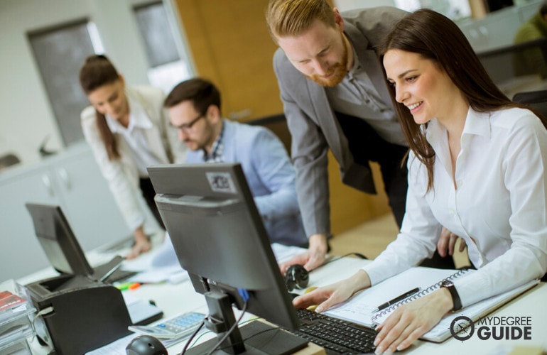 Computer and Information Systems Manager supervising his employees