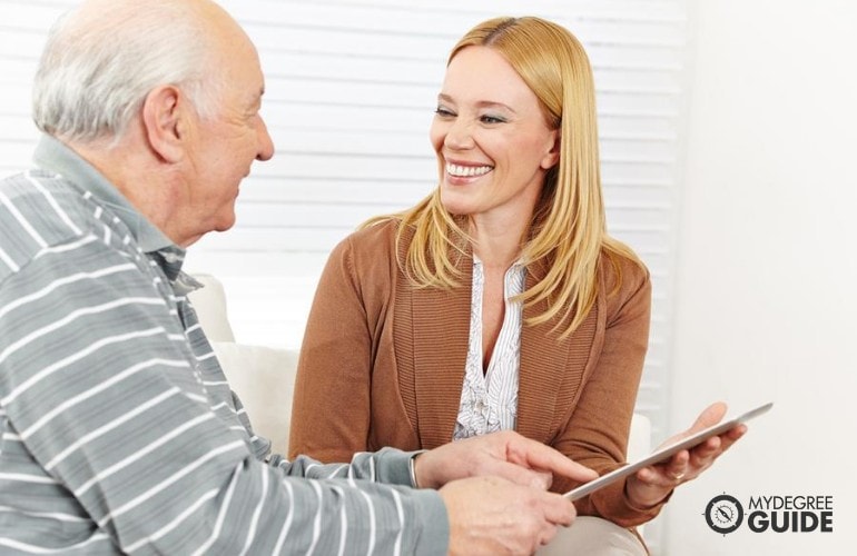 social worker attending to a senior man