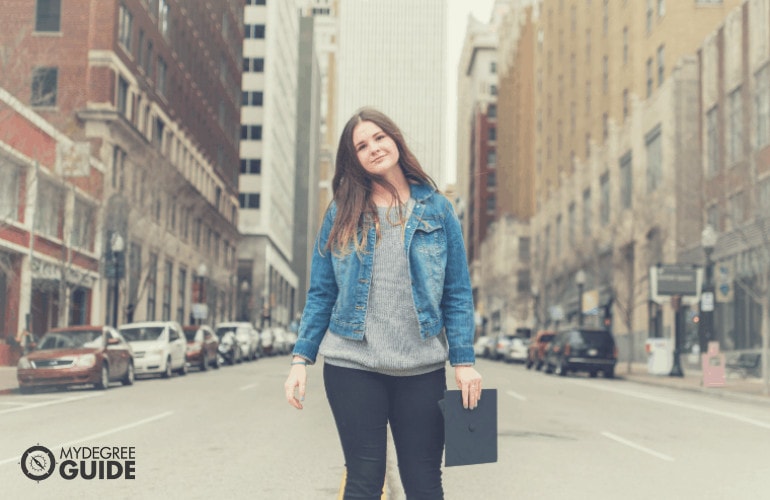 woman holding graduation cap