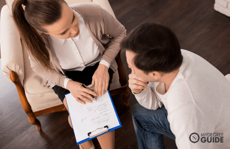 Government Psychologist talking to a patient during consultation