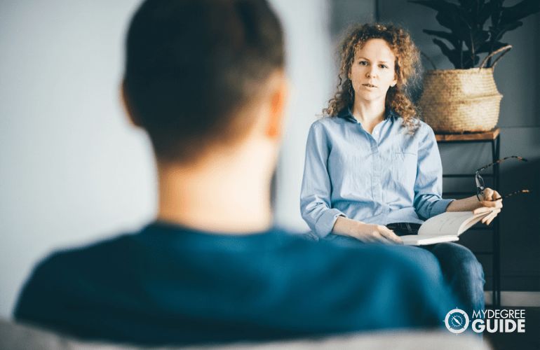 clinical counselor interviewing a patient